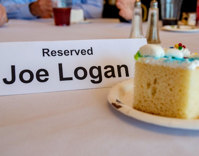 Joe Logan place card and slice of cake